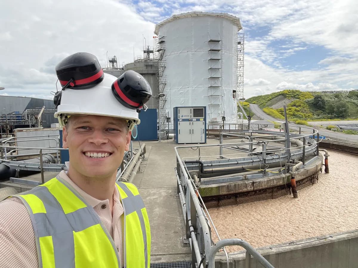 Researchable engineer in helmet and hi-vis vest at a process installation on site
